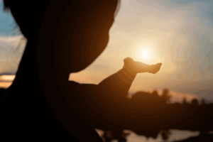 photo of person holding the sun in their hand representing the gift of organ donations