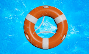 Orange LifeRing life ring splashing into blue water