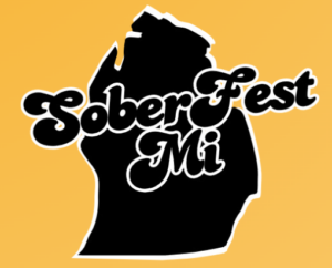 Black outline of the State of Michigan on a gold background. SoberFest MI written across.